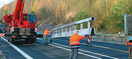 Photo during the installation of a crash barrier system from Meiser Strassenausstattung.
